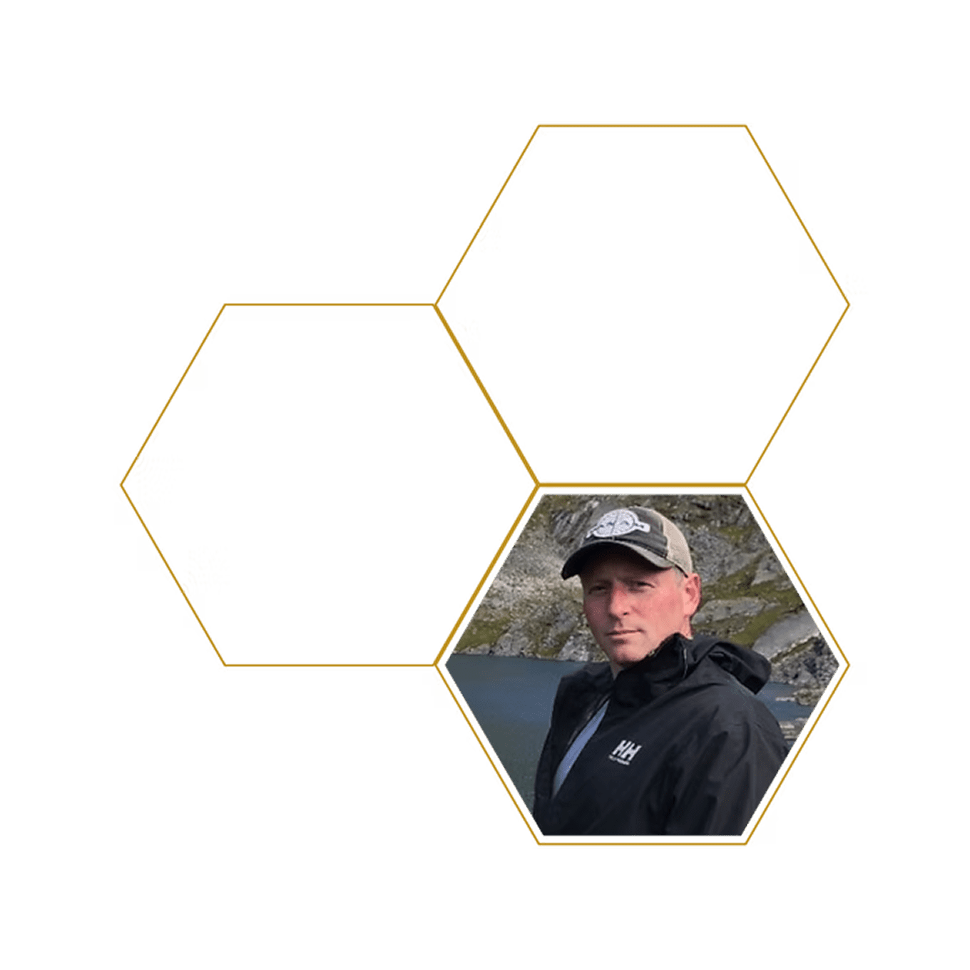 Man in cap by mountain lake