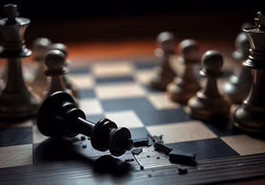 Broken chess piece on game board