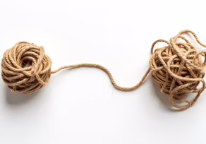 Entwined twine balls with loose ends