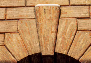 Close-up of a stone keystone in an arch.