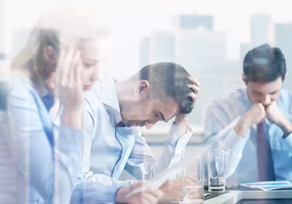 Stressed office workers at a table